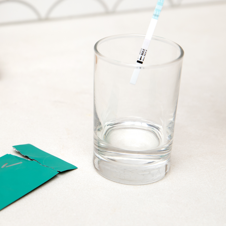 dipping proov reser fsh test into sample