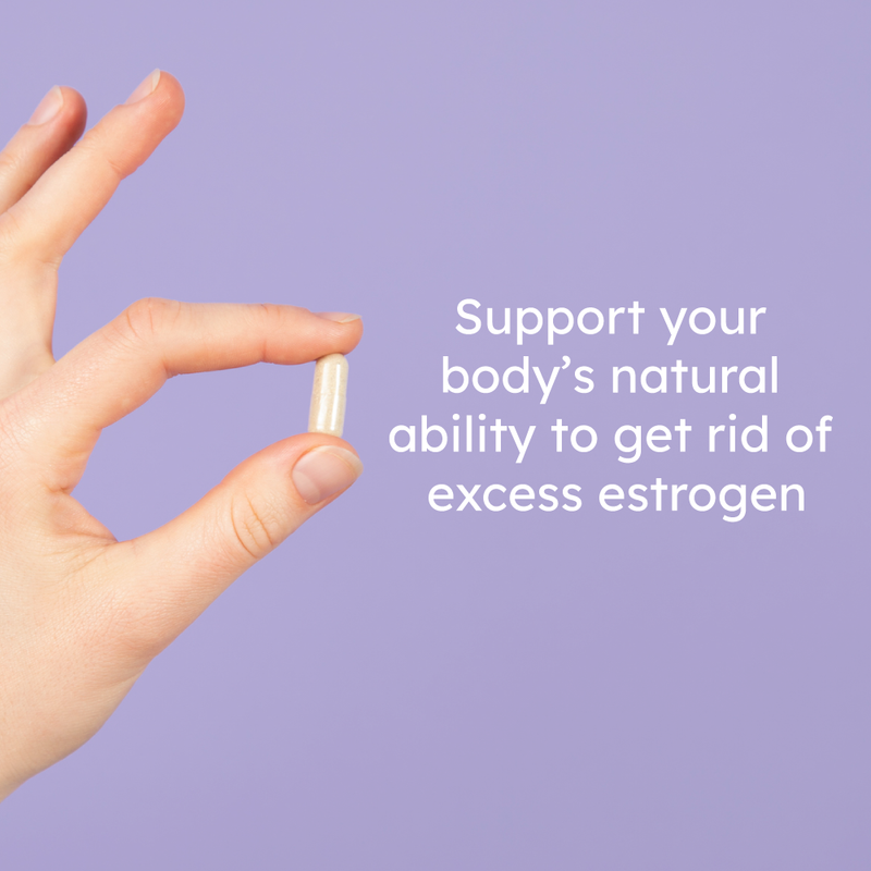 hand holding estrogen metabolism herbal supplement pill