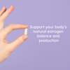 hand holding estrogen support herbal supplement pill